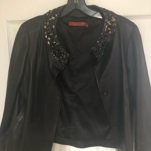 Leather jacket with stone collar trim
